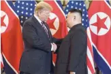  ?? — AFP ?? US President Donald Trump shakes hands with North Korea’s leader Kim Jong Un before a meeting at the Sofitel Legend Metropole Hotel in Hanoi on Wednesday.