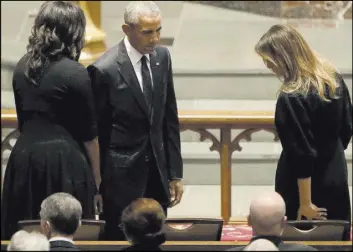  ?? David J. Phillip The Associated Press ?? Former President Barack Obama and former first lady Michelle Obama greet first lady Melania Trump on Saturday at the funeral service for former first lady Barbara Bush.