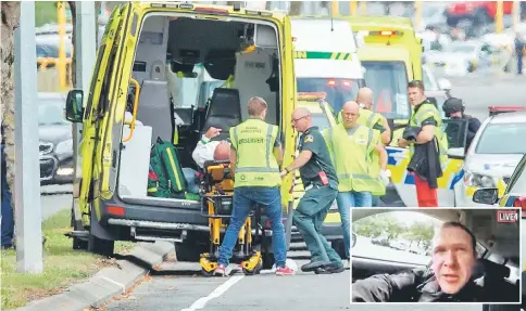  ?? — Reuters photo ?? An injured person is loaded into an ambulance following the shooting at the Al Noor mosque. (Inset) A still image taken from video circulated on social media, apparently taken by a gunman and posted online live as the attack unfolded, shows him driving in Christchur­ch.