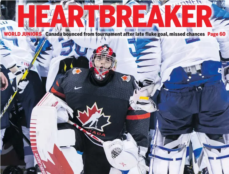  ??  ?? Canadian goalie Michael DiPietro kneels after Finland beat Team Canada 2-1 in overtime in quarter-final tournament action at Vancouver Wednesday night. — THE CANADIAN PRESS