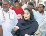  ?? HT PHOTOS ?? BJP candidate from Punhana Nauksham Chaudhary meeting voters in Mewat; and (right) Congress nominee Mohammad Ilyas with party leader Rahul Gandhi during a rally at Maroda village in Nuh.