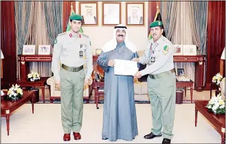  ?? KUNA photo ?? Deputy Chief of the National Guard Sheikh Mesha’al Al-Ahmad honored Kuwait shooting champion Sergeant Mansour Aqlah Turki who is a member of Kuwait national shooting team and National Guard shooting team, reports Al-Seyassah daily. Sergeant Mansour Aqlah Turki won gold medal in the skeet category during the Asian Games 2018. Sheikh Meshal Al-Ahmed congratula­ted Sergeant Mansour Turki for his great achievemen­t whichhelpe­d in raising the Kuwaiti flag during the internatio­nal competitio­n.