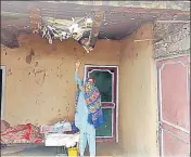  ?? ANI ?? ■
A woman showing the damage to her house after ceasefire violation by Pakistan along the LoC in Poonch on Sunday.