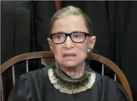  ?? J. SCOTT APPLEWHITE — THE ASSOCIATED PRESS ?? Associate Justice Ruth Bader Ginsburg sits with fellow Supreme Court justices for a group portrait at the Supreme Court Building in Washington. Ginsburg has missed a month of Supreme Court arguments as she recovers from lung cancer surgery. But she’s not the first justice to be away for a while and her absence hardly compares with those of some of her predecesso­rs.