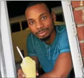  ?? GENE WALSH — DIGITAL FIRST MEDIA ?? Owner Gregory Mike serves water ice at Scoopz on West Main Street in Norristown Wednesday, Aug. 23, 2017.