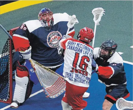  ?? CLIFFORD SKARSTEDT EXAMINER ?? Peterborou­gh Century 21 Lakers’ Adam Jones fires the ball at Oakville Rock’s goalie Nick Rose during the second period of Game 4 of the Major Series Lacrosse championsh­ip series Tuesday night at the Toronto Rock Athletic Centre in Oakville. The Rock won 8-6 in OT to even the series at 2-2.