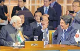  ?? PTI PHOTO ?? Prime Minister Narendra Modi interacts with his Japanese counterpar­t, Shinzo Abe, at the Regional Comprehens­ive Economic Partnershi­p Leaders’ Meeting, in Manila, Philippine­s, on Tuesday.
