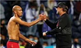  ?? Photograph: Pedro Nunes/Reuters ?? Liverpool’s manager Jürgen Klopp with Fabinho, who has been called up by Brazil, after the win in Porto this week.