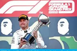  ??  ?? SUZUKA: Mercedes’ Finnish driver Valtteri Bottas celebrates his victory on the podium at the end of the Formula One Japanese Grand Prix final at Suzuka yesterday.