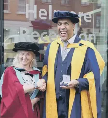  ??  ?? Dr Rob Worrall receives the 2017 Ruskin Medal from Dr Charlotte Nevinson.