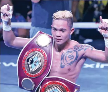  ?? ALEX BADAYOS/SS-CEBU ?? "Prince" Albert Pagara of Maasin City, Philippine­s is the new WBO Interconti­nental Jr. Featherwei­ght Champion after a TKO in 3rd round against Ghana, African boxer Laryea Gabriel Odoi during the Pinoy Pride 44 held in Maasin City.