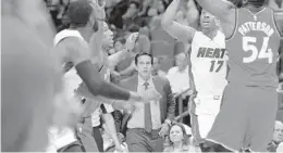  ?? MICHAEL LAUGHLIN/STAFF PHOTOGRAPH­ER ?? Miami coach Erik Spoelstra watches the Heat on offense against the Toronto Raptors during the first half of their game on Thursday at AmericanAi­rlines Arena.