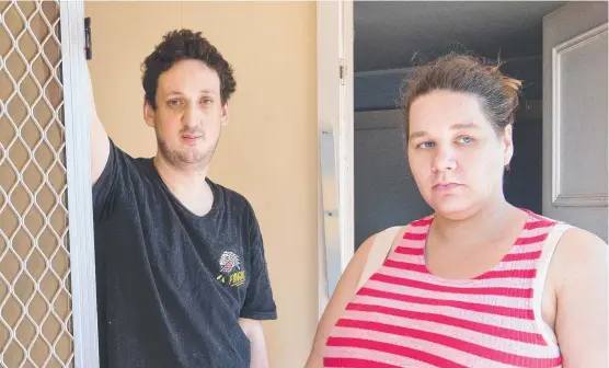  ?? Picture: Nev Madsen ?? DAMAGE DONE: Ken Noume and Emma Walker stand with the screen door of their Harristown home, which was broken during the theft of their car last month.