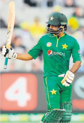  ?? Picture: EPA ?? SOLID. Pakistan’s Mohammad Hafeez raises his bat after reaching his half-century during the second one-day internatio­nal against Australia at the Melbourne Cricket Ground yesterday.