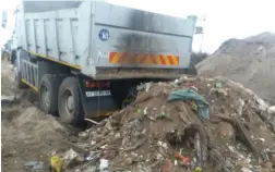  ??  ?? SHAMEFUL: Law enforcemen­t members caught the driver of a truck dumping rubble at a public open space in Olieboom Road, Philippi.