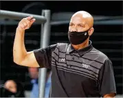  ?? CURTIS COMPTON CURTIS.COMPTON@AJC.COM ?? Led by coach Rob Lanier (pictured in 2020), the Panthers had to shut down last week when COVID-19 testing showed only five players were healthy enough to take to the court.