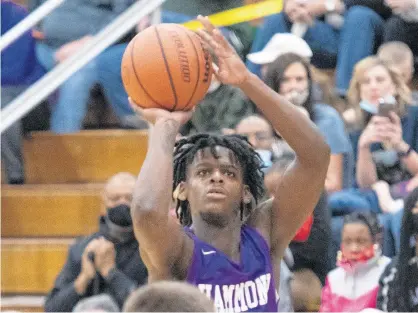  ?? POST-TRIBUNE PHOTOS BY MICHAEL GARD / ?? Hammond’s Harold Woods (3) takes a shot during the Class 3A South Bend Washington Regional semifinal on Saturday.