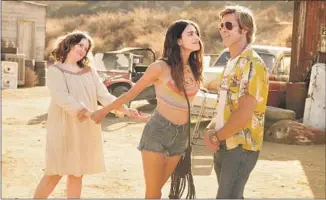  ?? Andrew Cooper Columbia Pictures ?? LENA DUNHAM, left, Margaret Qualley and Brad Pitt in “Once Upon a Time ... in Hollywood.”