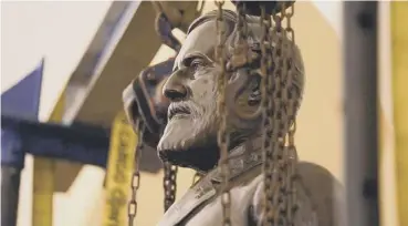  ??  ?? 0 Robert E Lee’s statue is removed from the National Statuary Hall Collection in Washington