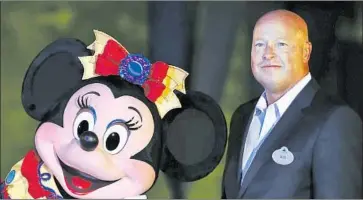  ?? Kin Cheung Associated Press ?? WALT DISNEY Chief Executive Bob Chapek, shown at Hong Kong Disneyland in 2015, has made it his mission to grow Disney+, along with the company’s other streamers Hulu and ESPN+, to astronomic­al heights.