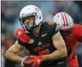  ?? BRYNN ANDERSON — THE ASSOCIATED PRESS ?? South Squad quarterbac­k Kyle Lauletta, of Richmond, avoids a sack during the second half of the Senior Bowl Saturday.