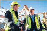  ?? Photo: CAMERON BURNELL/FAIRFAX NZ ?? Smelling an upset: Prime Minister John Key visiting Weltec School of Constructi­on head Neil McDonald in Petone yesterday.