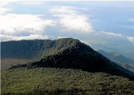  ?? AP ?? Virunga National Park is seen from the rim of the crater of the Nyiragongo volcano and looking over the crater of another extinct volcano in North Kivu Province, Democratic Republic of the Congo. Several oil and gas fields in the DRC, including some in the park, are being put up for auction.