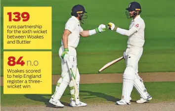  ?? Reuters ?? ■
England’s Jos Buttler with Chris Woakes congratula­te each other during their partnershi­p in the first Test against Pakistan at the Emirates Old Trafford in Manchester yesterday.