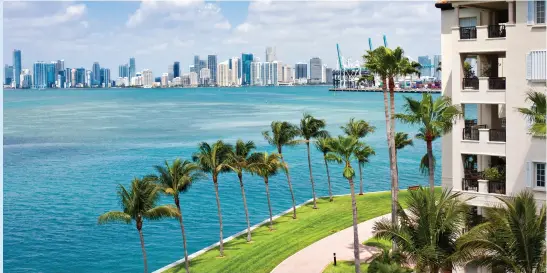  ??  ?? WATERFRONT CONDOS, DOWNTOWN MIAMI • SHUTTERSTO­CK/DANIEL KORZENIEWS­KI