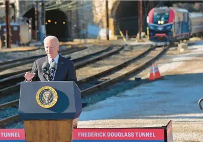  ?? KARL MERTON FERRON/BALTIMORE SUN PHOTOS ?? President Joe Biden visits Penn Station in Baltimore on Monday to talk about the Bipartisan Infrastruc­ture Law funding that will replace the 150-year old Baltimore and Potomac Tunnel.