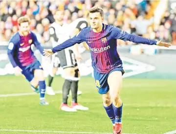  ?? — AFP photo ?? Barcelona’s Brazilian midfielder Philippe Coutinho celebrates a goal during the Spanish ‘Copa del Rey’ (King’s cup) second leg semi-final football match between Valencia CF and FC Barcelona at the Mestalla stadium in Valencia on February 8, 2018.