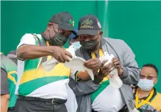  ?? — AFP photo ?? Ramaphosa (left) and his Deputy David Mabuza hold doves during the ANC’s 110th anniversar­y celebratio­ns at the Old Peter Mokaba Stadium in Polokwane.