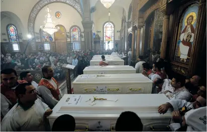  ?? (Mohamed Abd El Ghany/Reuters) ?? MOURNERS GATHER for the funeral in Minya, Egypt, of Coptic Christians killed in an attack on Friday.