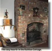  ??  ?? The cosy hearth in the Rathlee Cottage.