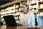  ?? PAVEL GOLOVKIN — THE ASSOCIATED PRESS ?? Estonian Prime Minister Kaja Kallas votes on a laptop via an internet voting system during a parliament­ary elections in Tallinn, Estonia, on Wednesday.