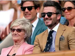  ??  ?? Shades... Beckham and mum Sandra at Wimbledon yesterday