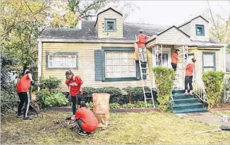  ?? CONTRIBUTE­D BY REBUILDING TOGETHER ATLANTA ?? Rebuilding Together Atlanta and Honeywell renovated homes for five families in Grove Park. The volunteers painted, landscaped and made repairs so low-income, older adults could stay in their homes.