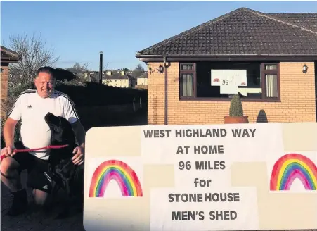  ??  ?? Here we go David Baxter and Shadow the dog at the start of their West Highland Way at home