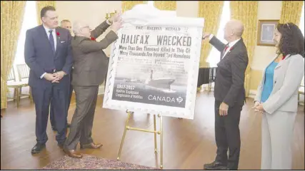  ?? RYAN TAPLIN/The ChRoNICLe heRALd ?? Nova Scotia Lt.-Gov. Arthur J. LeBlanc and Halifax MP Andy Fillmore unveil a stamp commemorat­ing the 100th anniversar­y of the Halifax Explosion during a ceremony at Government House on Monday morning.