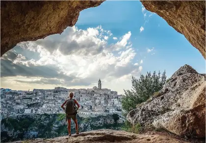  ?? ?? OFF ROAD: A hiker gets a good view of Matera in southern Italy