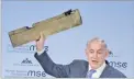  ??  ?? AP Israeli Prime Minister Benjamin Netanyahu, holds what he calls a part of a drone during his speech at the Munich Security Conference, MSC, in Munich, Germany, on Feb. 18, 2018.