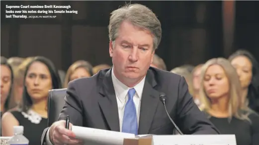  ?? JACQUELYN MARTIN/AP ?? Supreme Court nominee Brett Kavanaugh looks over his notes during his Senate hearing last Thursday.