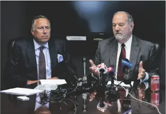  ?? AP PHOTO/MICHAEL CONROY ?? Attorneys Daniel Chamberlai­n (left) and Melvin Hewitt, Jr. announce a lawsuit in Indianapol­is, on Monday on behalf of five families of the victims murdered in a mass shooting at the Indianapol­is FedEx Ground facility in 2021.