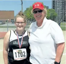  ?? SUBMITTED PHOTO ?? Adam Scott Collegiate coach Linda DeJeu is seen at the 2017 OFSAA track and field championsh­ips in Belleville with her final Adam Scott athlete Heather Humphrey, who was in shotput.