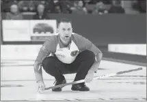  ?? Canadian Press photo ?? Newfoundla­nd and Labrador skip Brad Gushue watches a rock as they play Manitoba in 1 vs. 2 Page playoff game action at the Tim Hortons Brier curling championsh­ip at Mile One Centre, in St. John's on Friday.