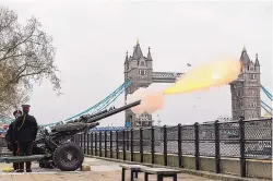  ?? DOMINIC LIPINSKI/PA MEDIA VIA AP ?? Members of the Honourable Artillery Company fire a 41-round gun salute from the wharf at the Tower of London on Saturday to mark the death of Prince Philip a day earlier.