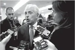  ?? Associated Press ?? Sen. Bob Corker, R-Tenn., speaks on Thursday in Washington to reporters while heading to vote on budget amendments.