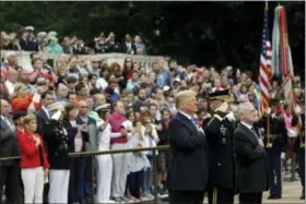  ?? EVAN VUCCI — THE ASSOCIATED PRESS ?? President Donald Trump participat­es in a wreath laying ceremony at the Tomb of the Unknown Solider at Arlington National Cemetery, Monday in Arlington, Va., with Defense Secretary Jim Mattis, right. and Maj. Gen. Michael L. Howard, commanding general...