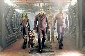  ?? ASSOCIATED PRESS PHOTO/DISNEY - MARVEL ?? This image released by Disney - Marvel shows, from left, Zoe Saldana, the character Rocket Racoon, voiced by Bradley Cooper, Chris Pratt, the character Groot, voiced by Vin Diesel, and Dave Bautista in a scene from Guardians of the Galaxy.