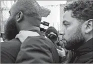  ?? KAMIL KRZACZYNSK­I/AP PHOTO ?? “Empire” actor Jussie Smollett leaves Cook County jail following his release Thursday in Chicago. Smollett was charged with disorderly conduct and filling a false police report when he said he was attacked in downtown Chicago by two men, a police official said.